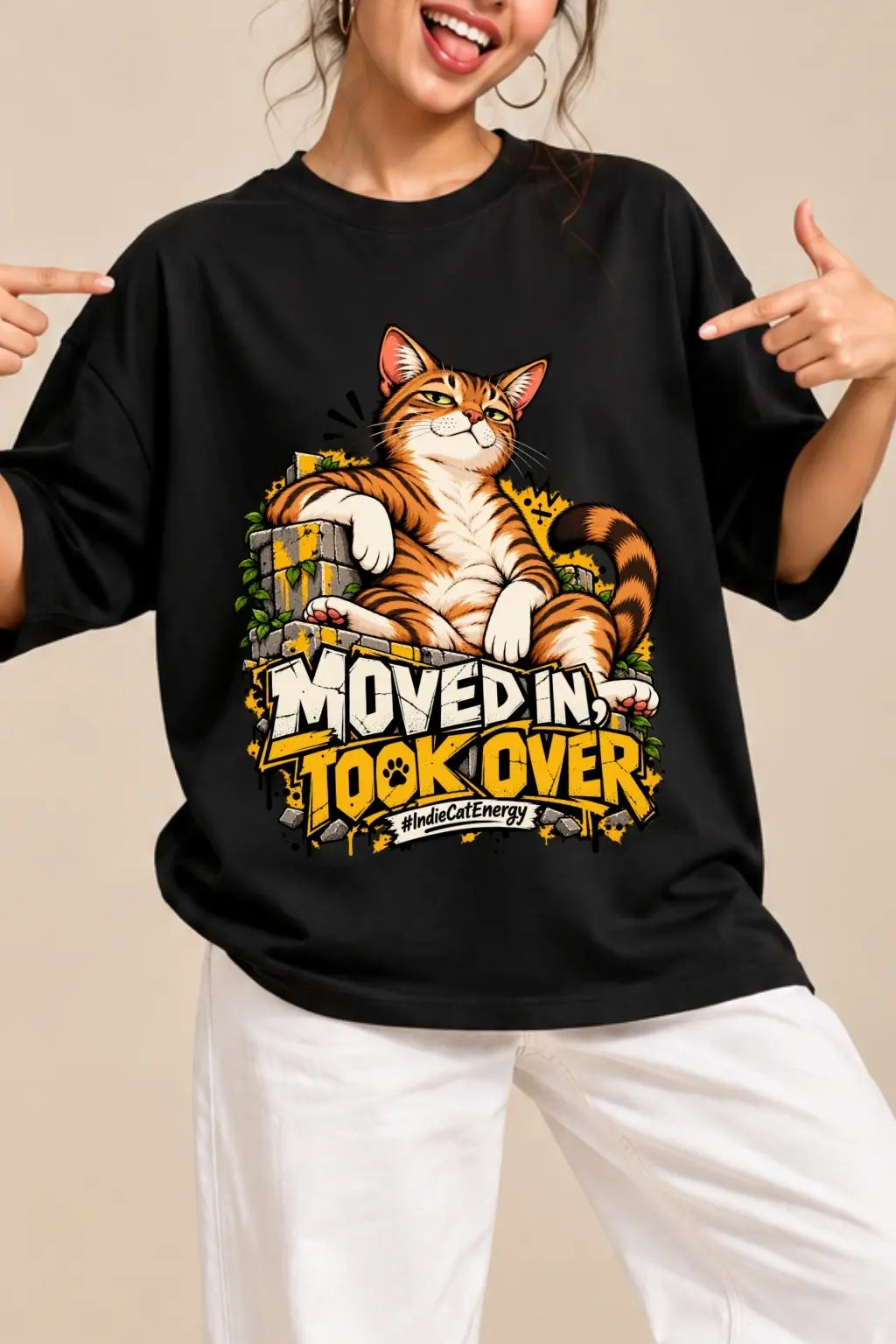 Close-up of Moved In Took Over #IndieCatEnergy DTF cat print on black unisex oversized terry t-shirt | JUNOSHI