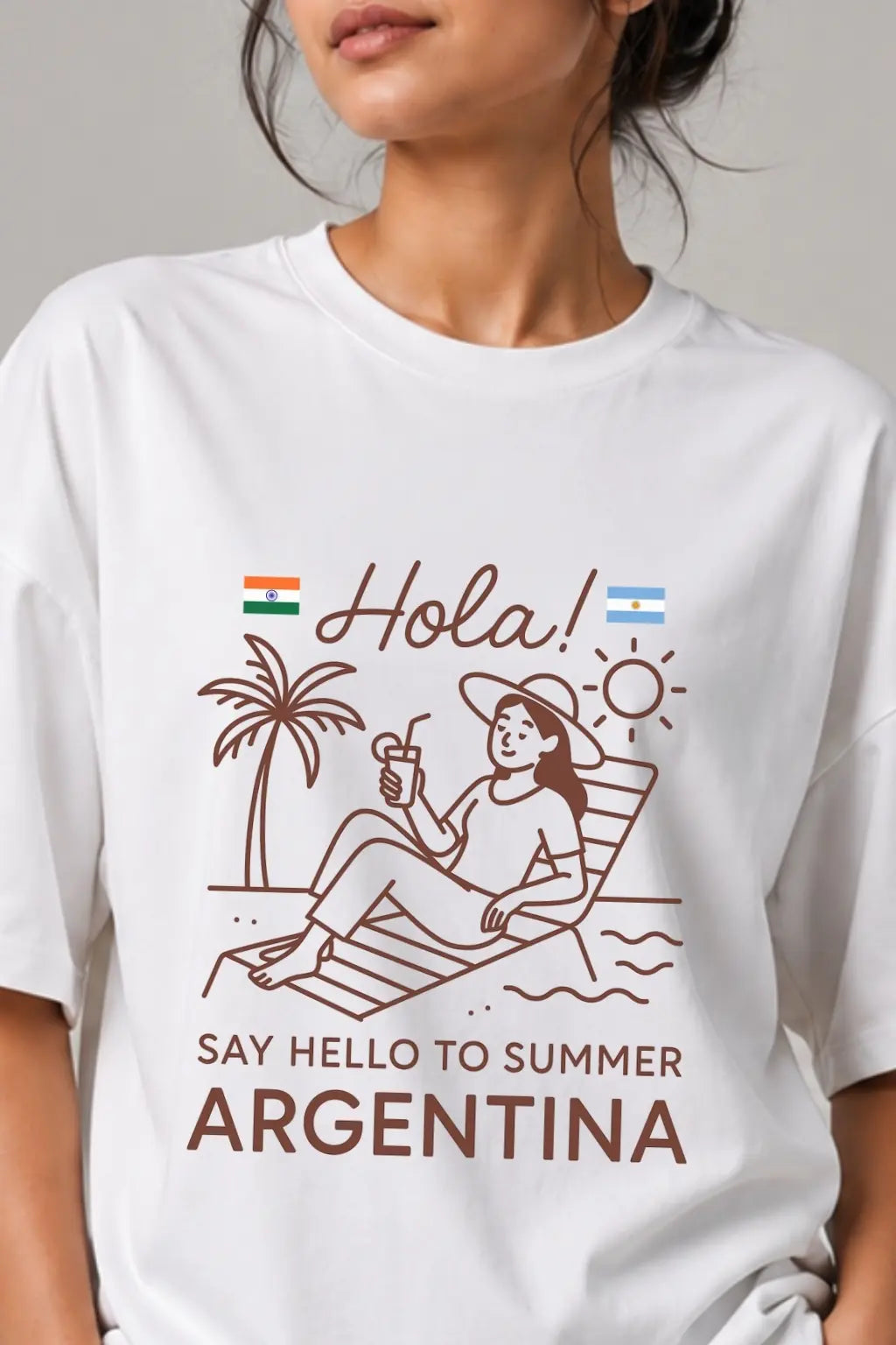 Close-up of Hola Argentina beach print on white oversized tee — Indian travel streetwear by JUNOSHI