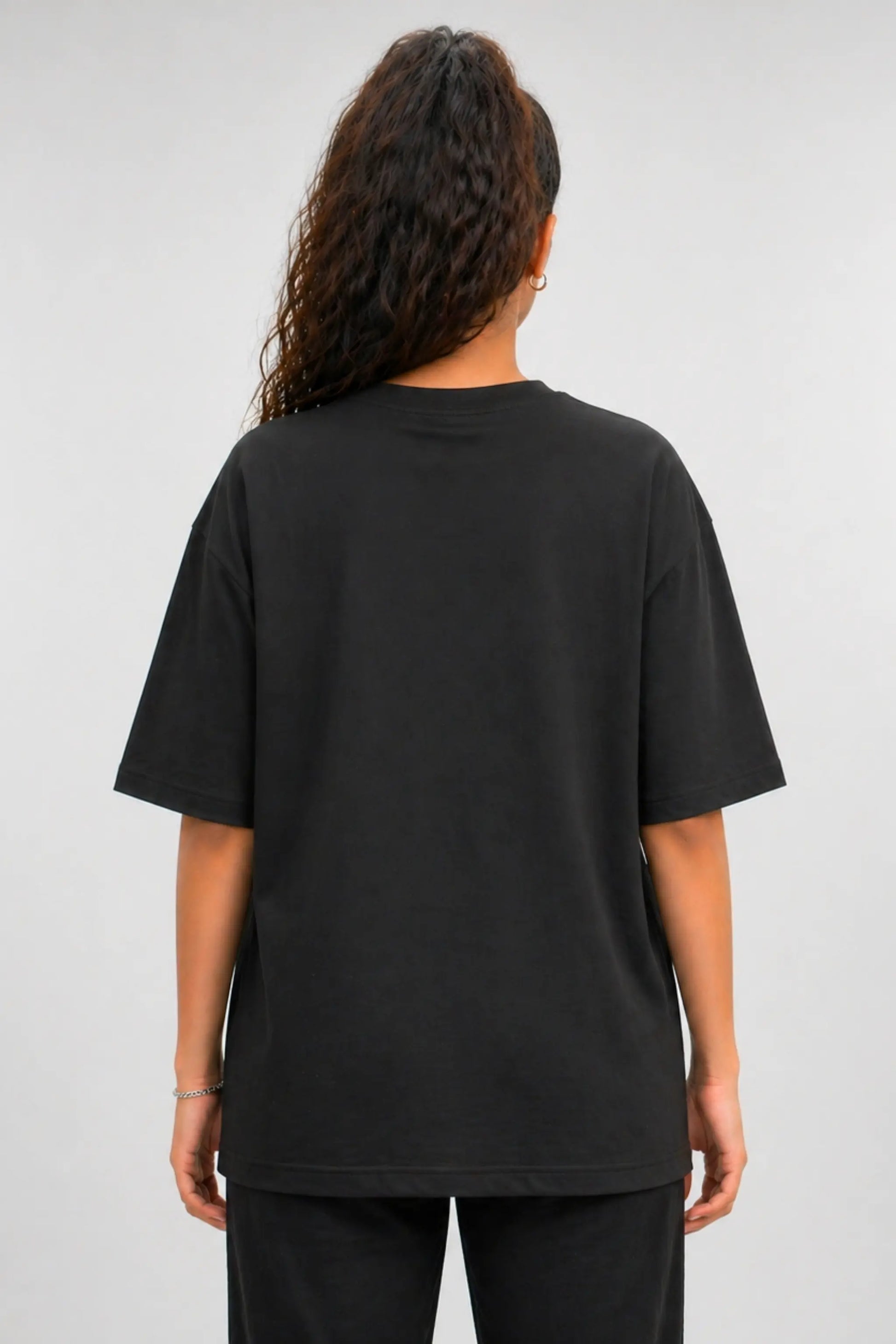 Back view of black oversized unisex t-shirt, clean plain back, JUNOSHI Vietnam collection