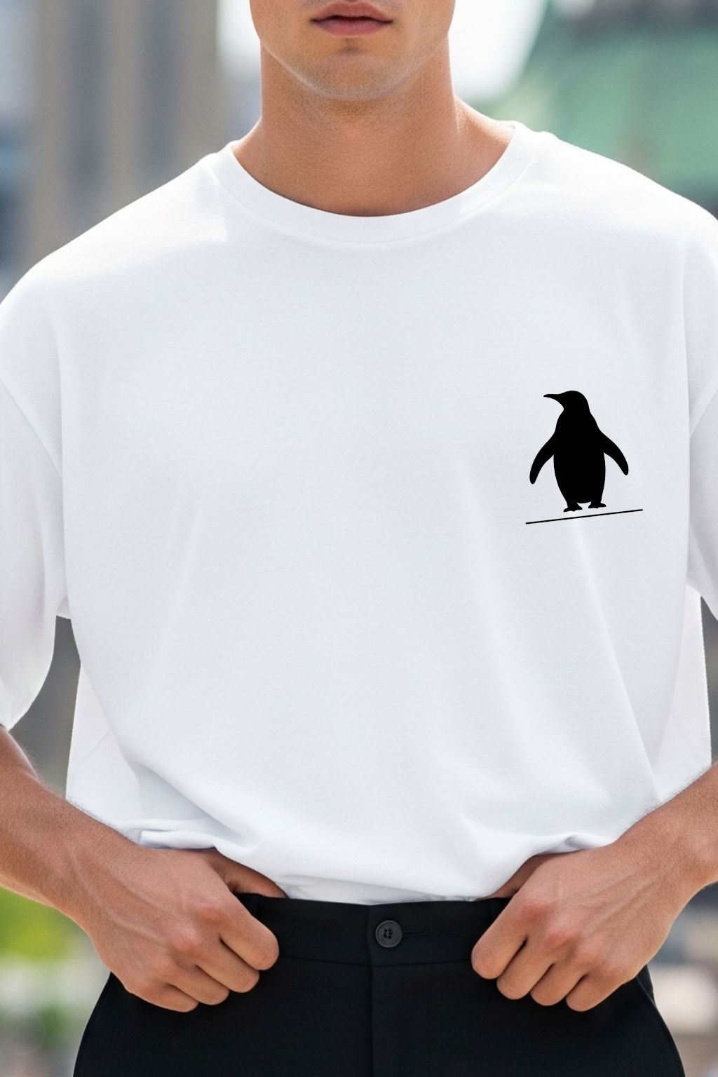 Close-up of the Nihilist Penguin DTF print on JUNOSHI white oversized t-shirt — bold black graphic, crisp DTF print detail