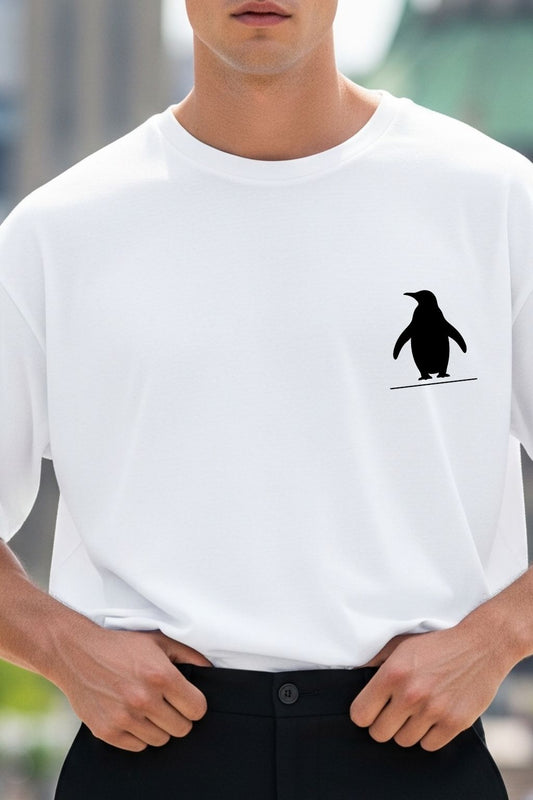 Close-up of the Nihilist Penguin DTF print on JUNOSHI white oversized t-shirt — bold black graphic, crisp DTF print detail