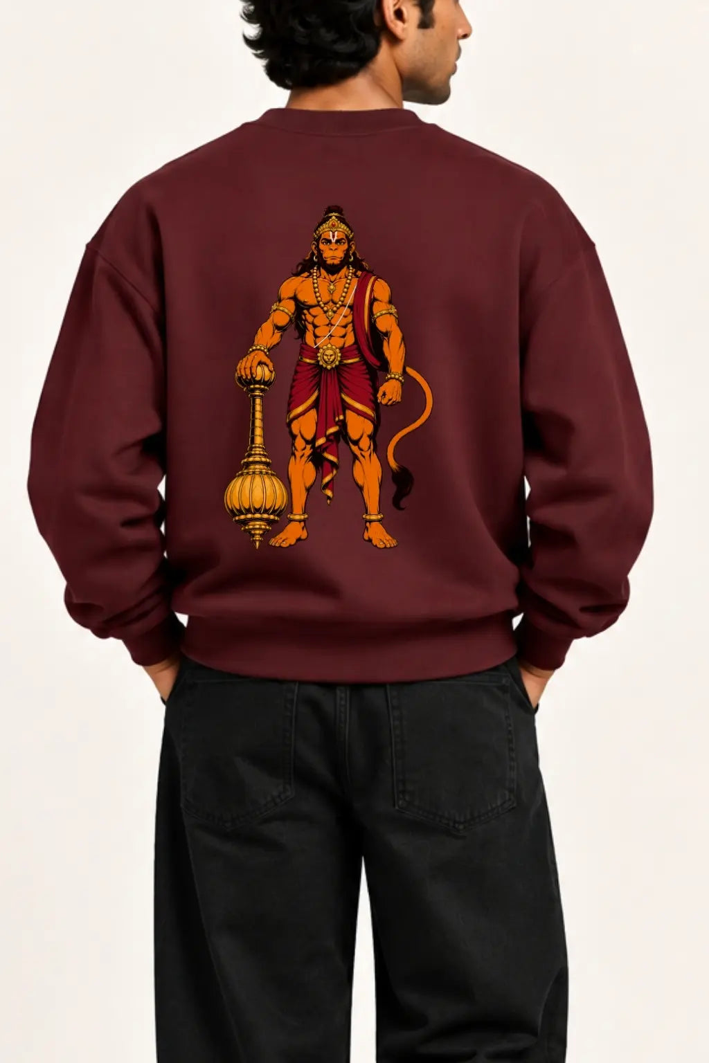 Close-up of the Lord Hanuman back print with gada, tilak and traditional iconography on a maroon oversized sweatshirt | JUNOSHI