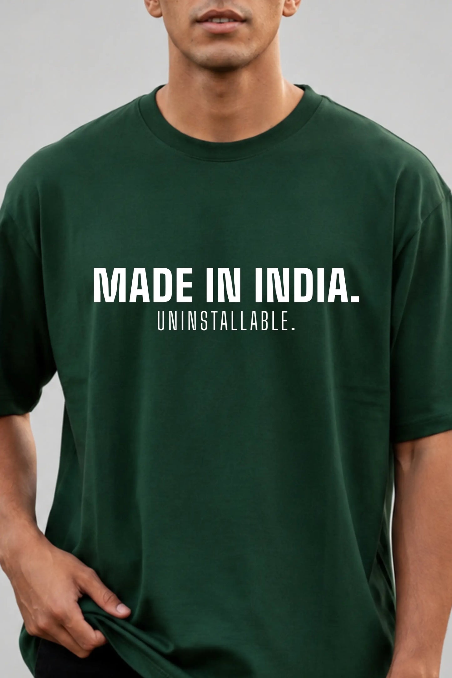 Made In India. Uninstallable. Bold Typography Print Closeup — Bottle Green Men's Oversized Tee | JUNOSHI