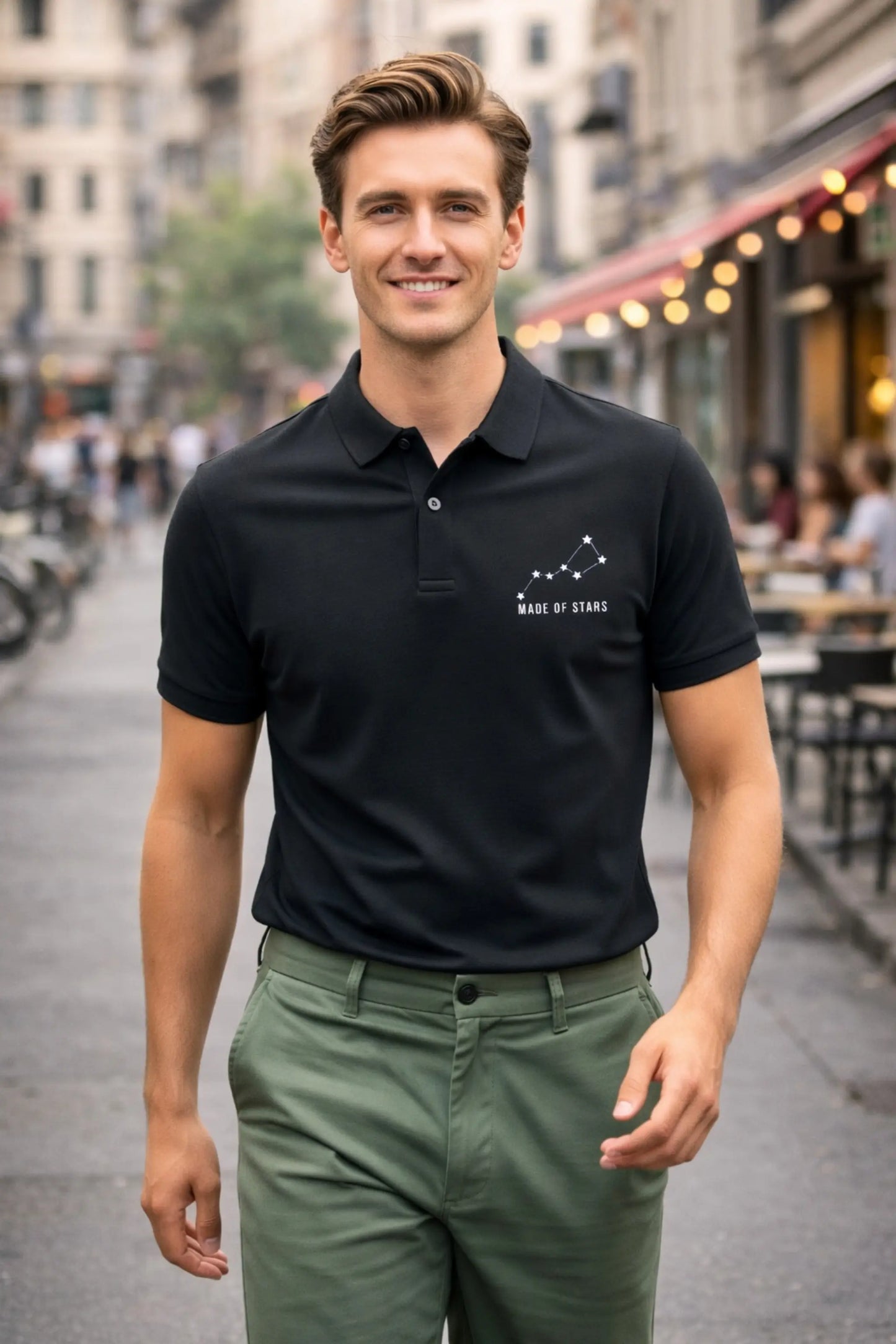 JUNOSHI Made of Stars black polo — man wearing constellation polo walking on urban street, smart casual street style