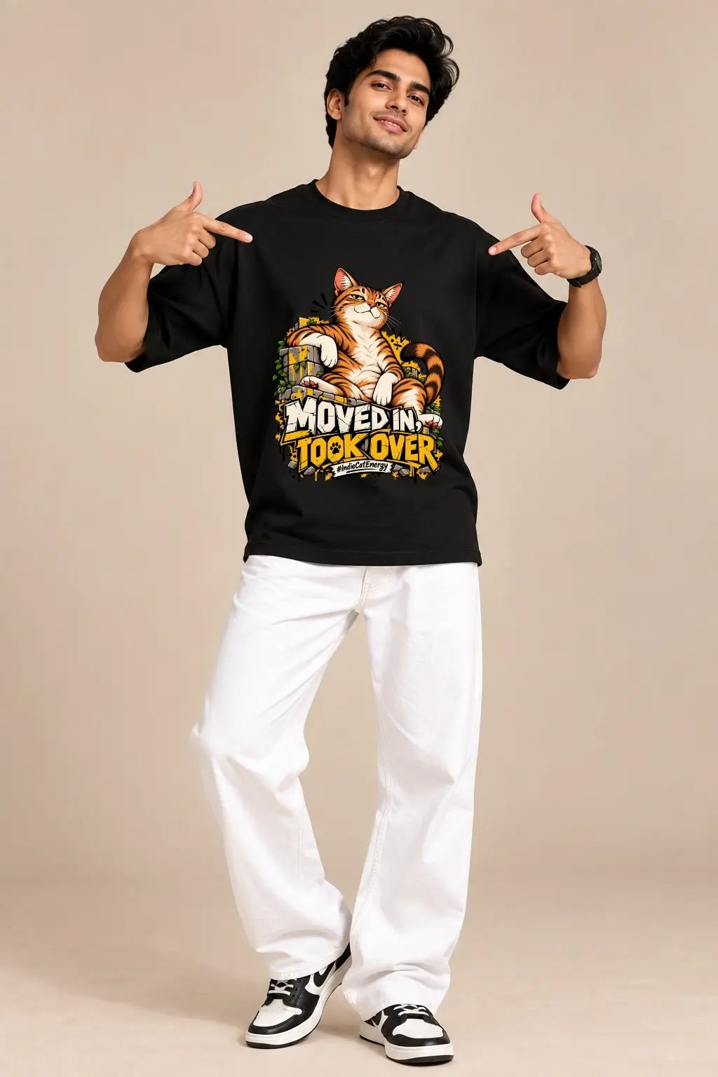 Man wearing black Moved In Took Over Indie Cat unisex oversized terry t-shirt with white pants and sneakers | JUNOSHI
