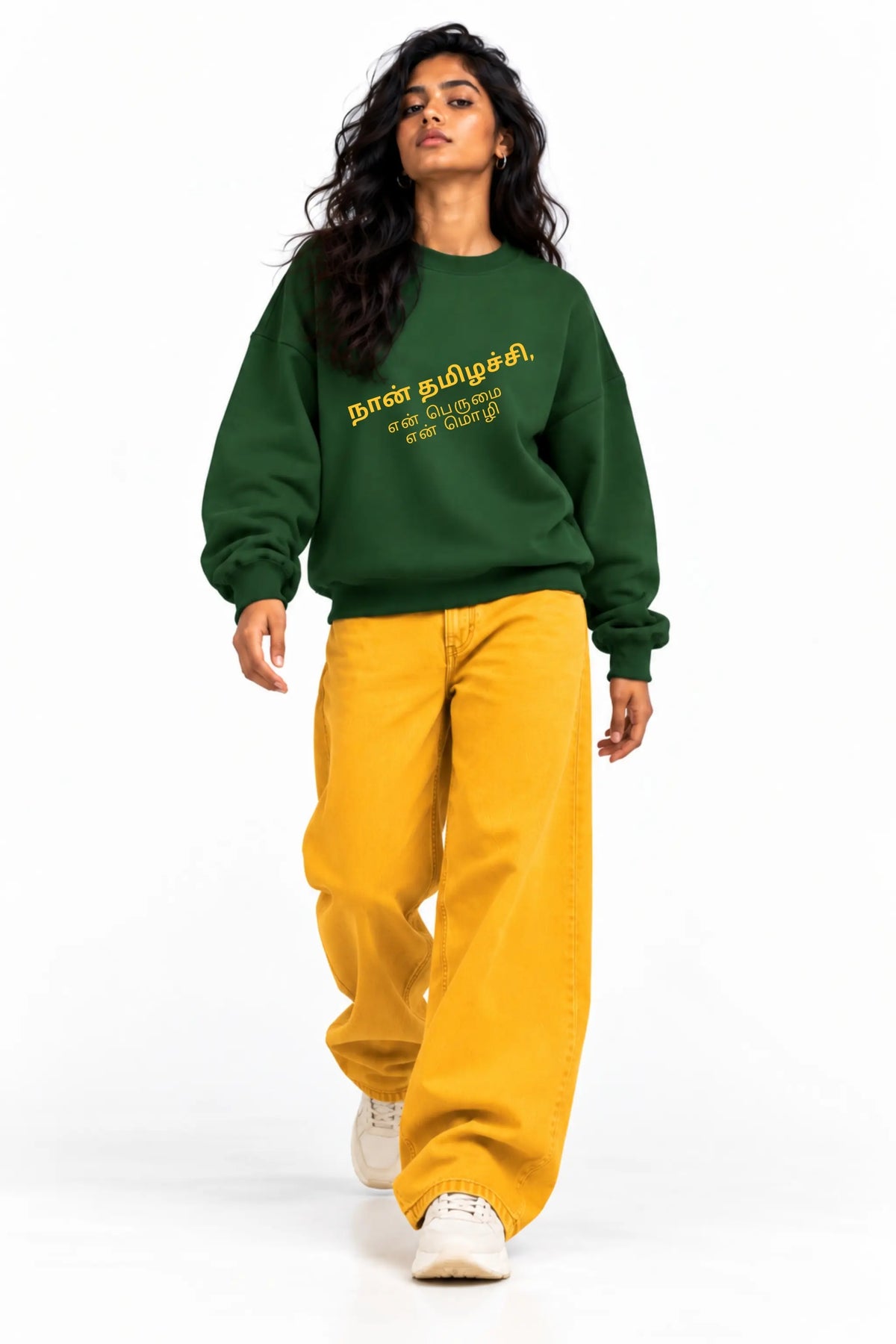 Naan Thamizhachi Tamil pride oversized sweatshirt in bottle green, styled with mustard wide-leg jeans | JUNOSHI