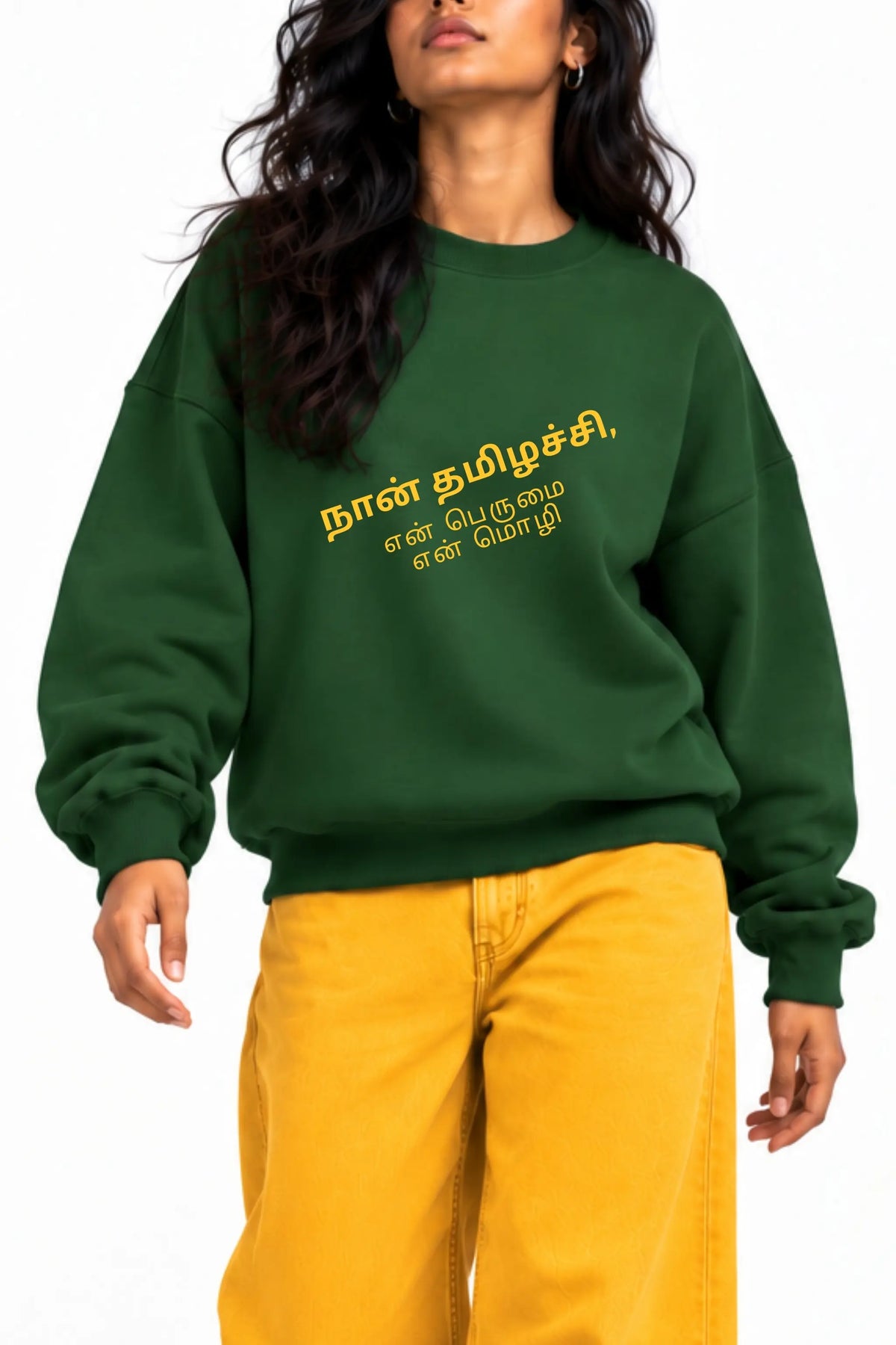 Close-up of Naan Thamizhachi Tamil quote in mustard script on a bottle green oversized sweatshirt | JUNOSHI