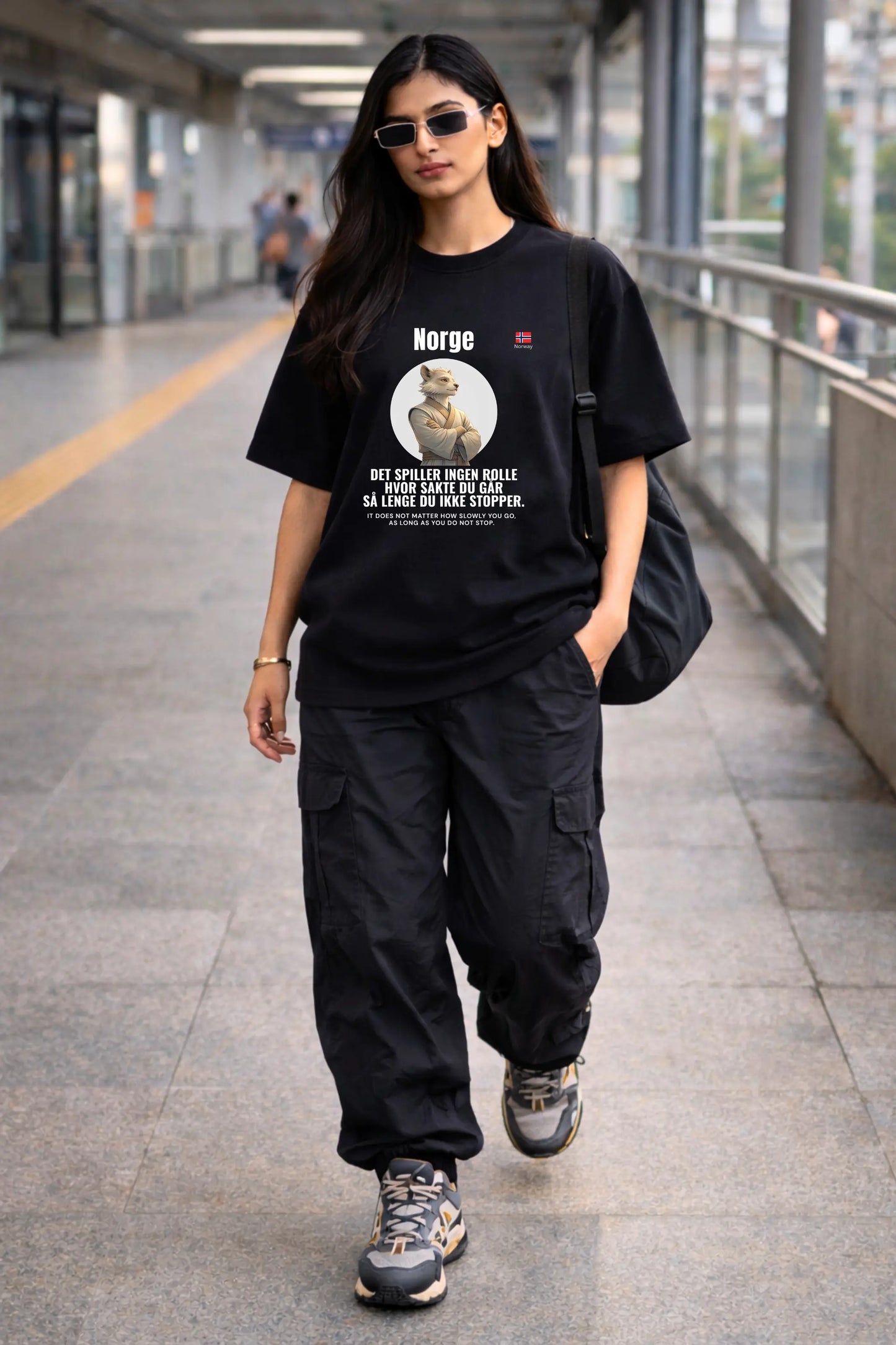 Female street style — Norge Ikke Stopper Oversized Terry Tee worn on metro platform, JUNOSHI Shifu's World