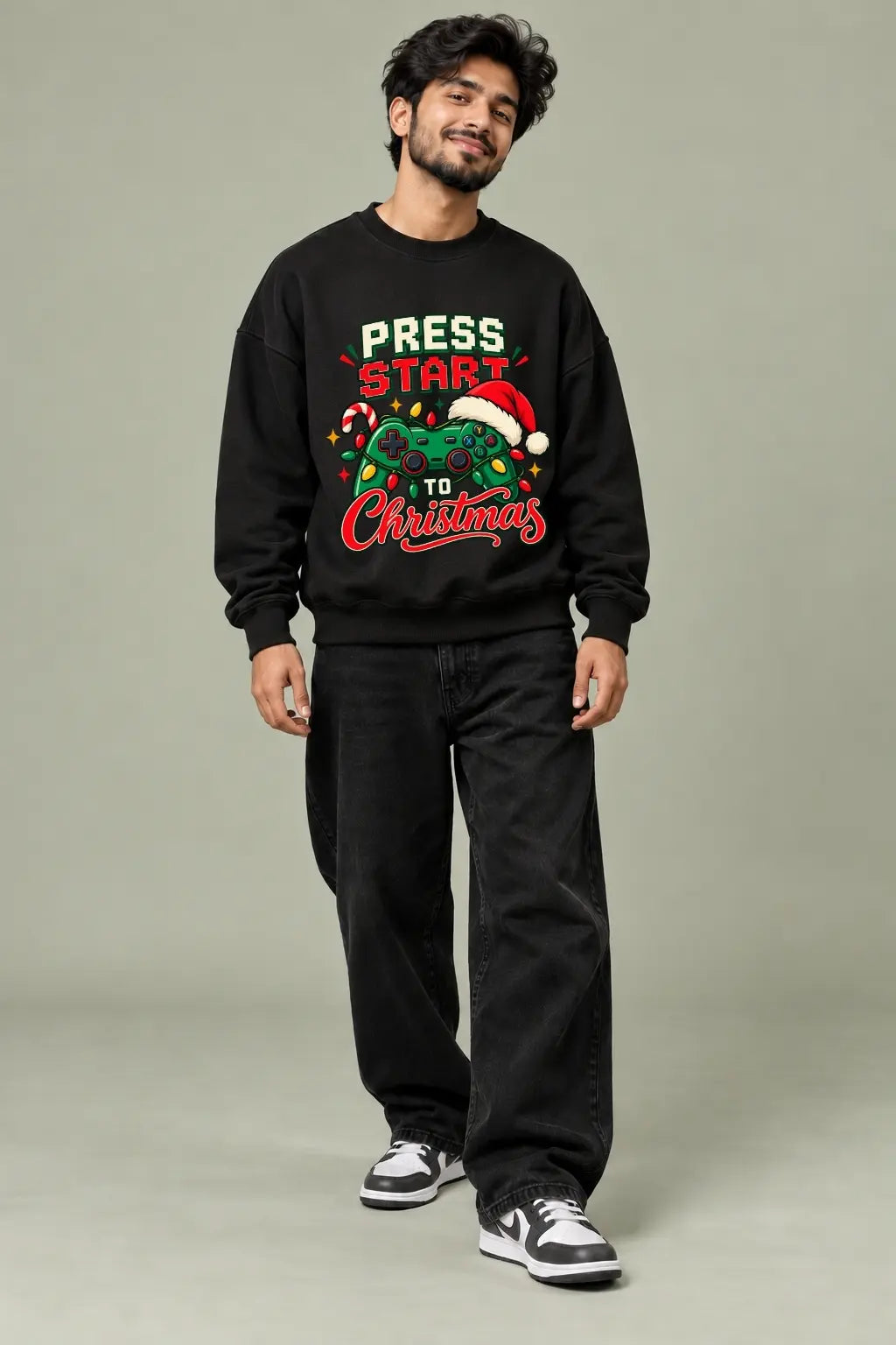Press Start To Christmas — Gamer Christmas Oversized Sweatshirt worn by male model, front view | JUNOSHI