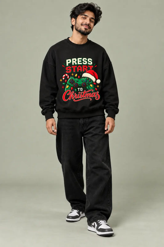 Press Start To Christmas — Gamer Christmas Oversized Sweatshirt worn by male model, front view | JUNOSHI