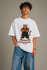 Young Indian man wearing JUNOSHI Chose Violence Gym Wala Oversized Terry Tee in white — bold Bablu Dhamaka tiger graphic with crossed arms and protein bottle, desi streetwear front view