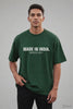 Made In India. Uninstallable. — Bottle Green Unisex Oversized Tee, Men's Reel Thumbnail | JUNOSHI Unfiltered