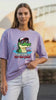 video mockup of a woman wearing a Too Cool Croc Lavendar Oversized T-shirt
