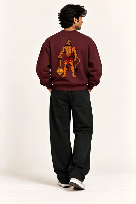 Back view of a maroon oversized sweatshirt with a Lord Hanuman gada illustration in orange and gold, devotional streetwear | JUNOSHI