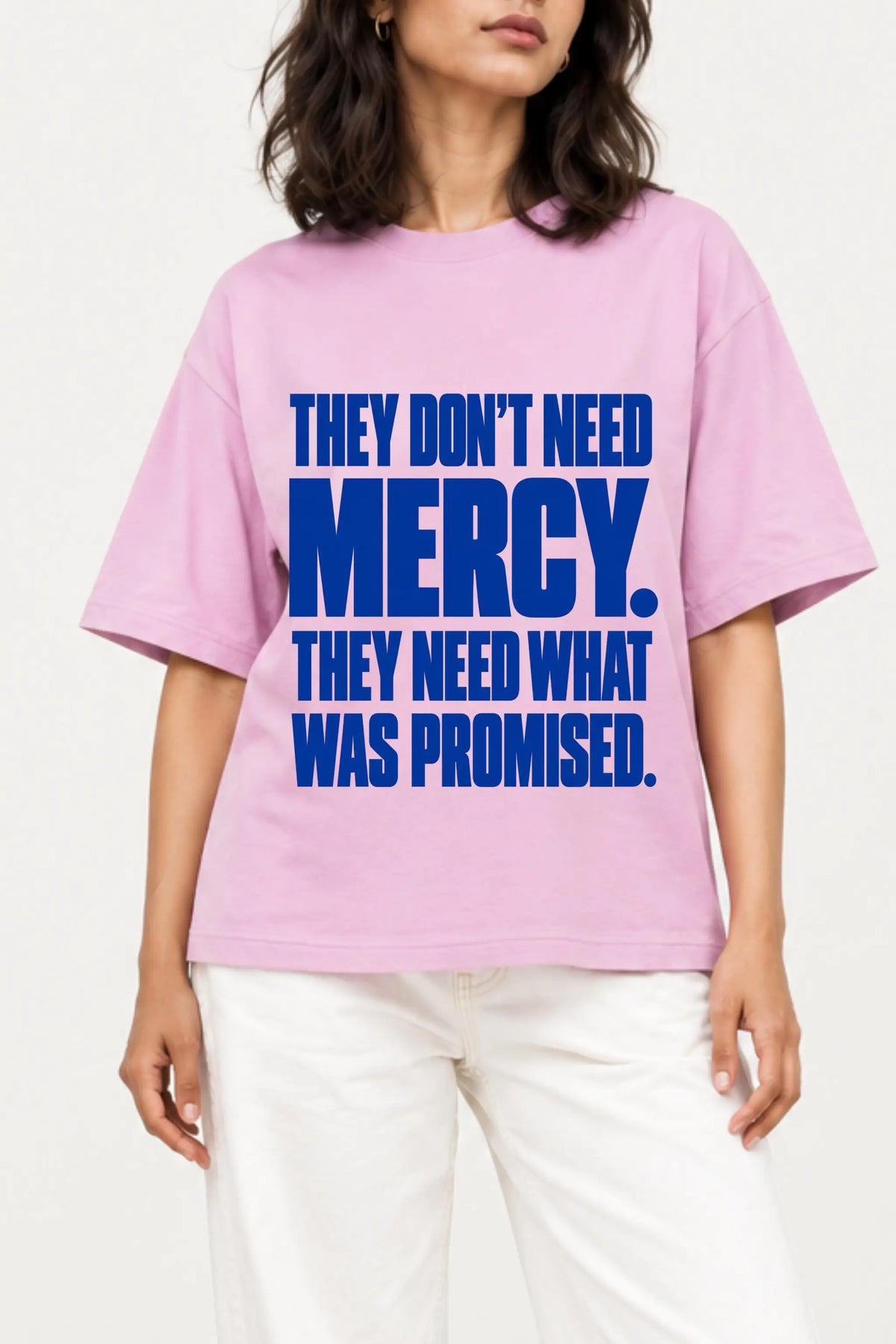 They Don’t Need Mercy — close-up of bold blue typography DTF print on lilac oversized constitution t-shirt | JUNOSHI