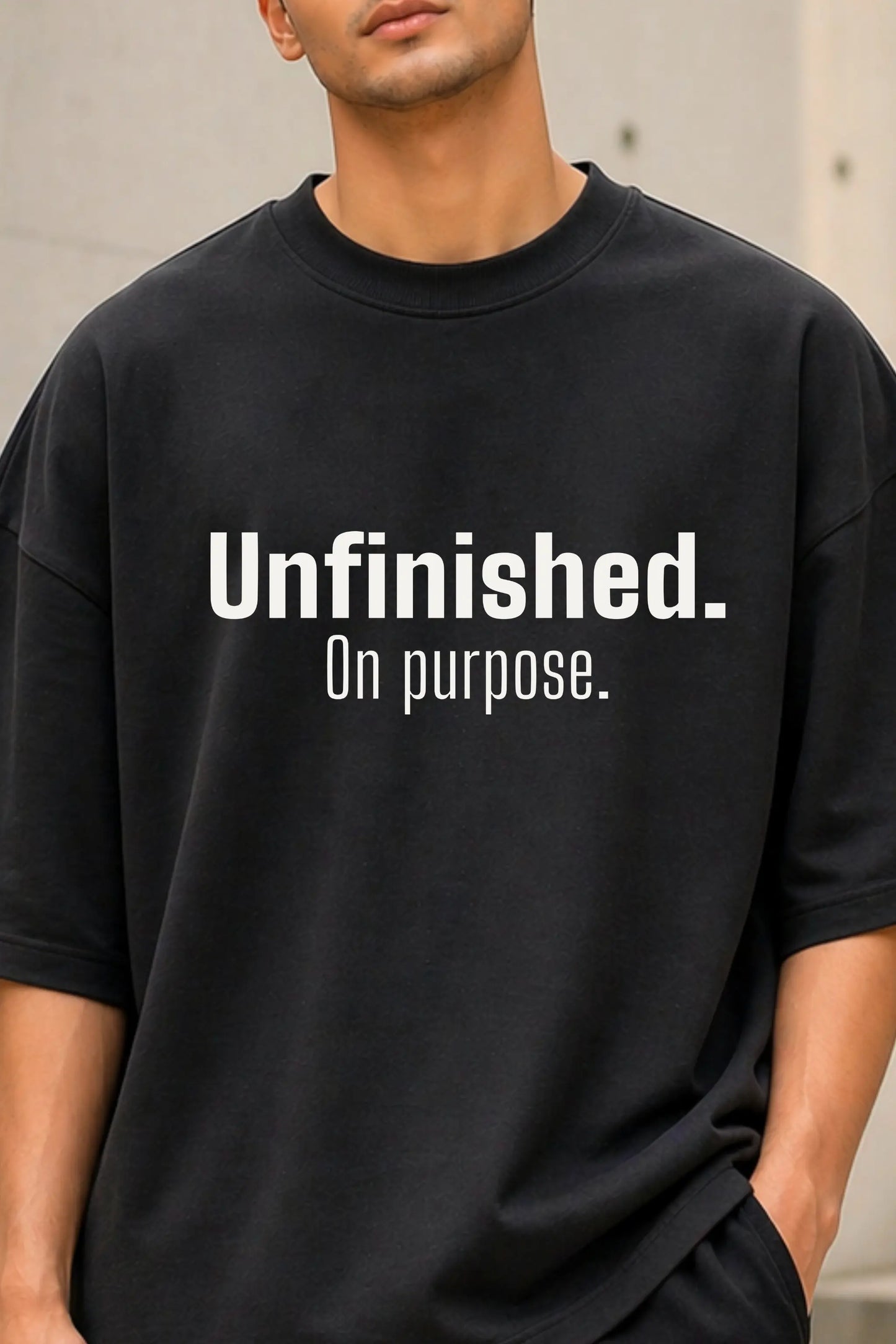 Unfinished On Purpose bold typography print closeup on black oversized tee — JUNOSHI Unfiltered