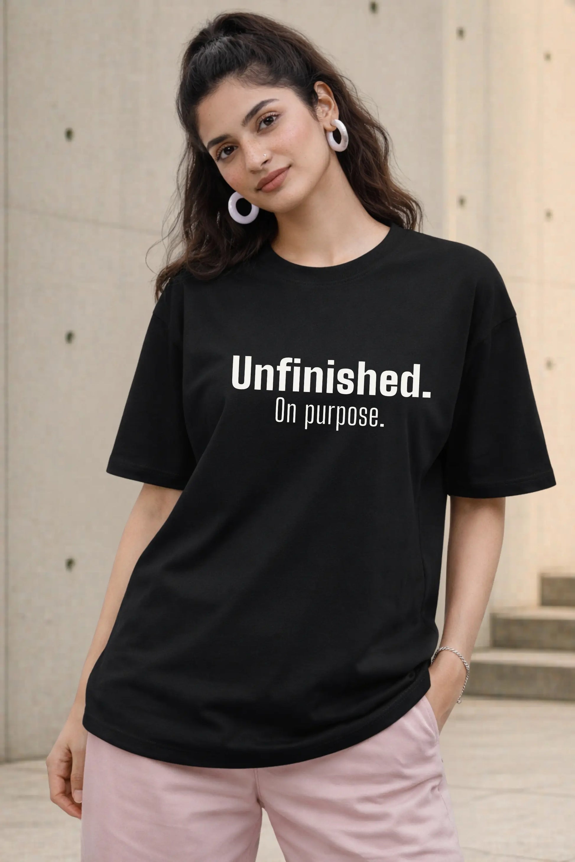 Unfinished On Purpose black oversized tee on women — bold identity streetwear